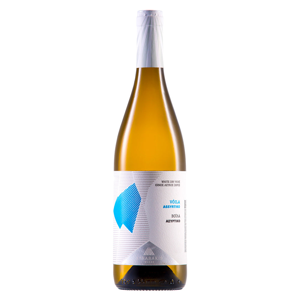 A bottle of Marakia Volla Assyris white wine, featuring a pale golden-amber liquid inside a dark glass bottle with a white label and blue graphic accent, set against a plain white background.